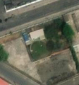 4/5 Réservoir couvert (man_made=reservoir_covered) de forme ronde, le long de la route, dans une zone urbaine dense, à Pyongyang (imagerie satellite Maxar).