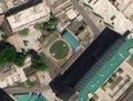 5/5 Réservoir couvert (man_made=reservoir_covered) de forme ronde, au milieu d'une zone urbaine dense, à Pyongyang (imagerie satellite Maxar).